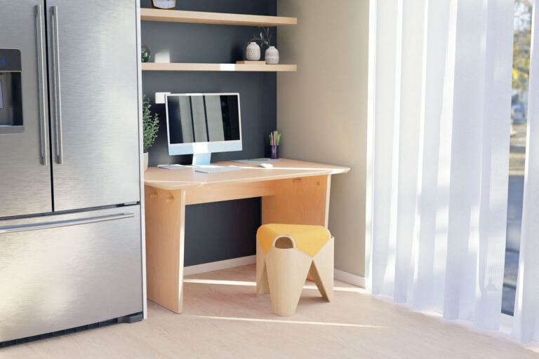 The Stubby Ecosium Sustainable Desk nestled in next to the kitchen against a charcoal coloured wall in a modern townhouse 2